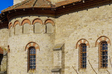 Windows of an ancient stone building of classical architecture. Background with selective focus and copy space