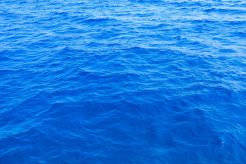 Obraz premium Very nice sea water background or backdrop with selective focus. Small waves of natural water surface texture.