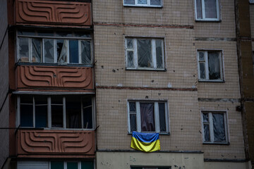 Ukraininan flag in destroyed and damaged residential buildings in Irpen after Russia's invasion of Ukraine