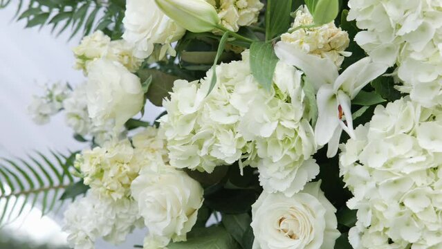 Closeup of a bouquet of flowers at a wedding.