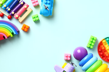 Colorful kids toys on pastel blue background. Top view. Flat lay.