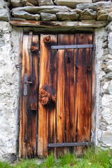 rustic wooden door on an alpine hut