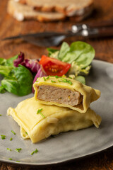 swabian maultasche with onions on a plate