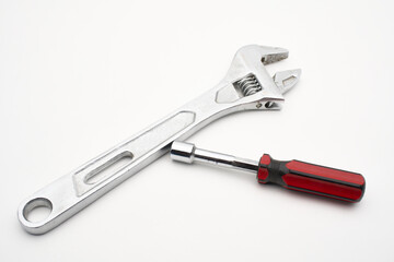 wrench and screwdriver on white 