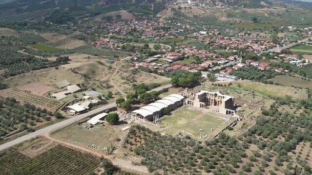 Aerial view with drone; Sardes (Sardis) Ancient City which has gymnasium and synagogue ruins and columns in Manisa, Turkey.