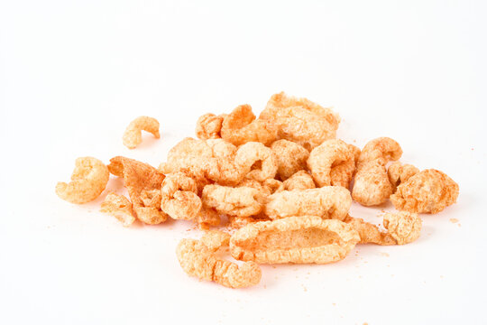 pile of pork rinds isolated on white 