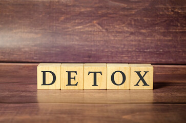 detox word written on wood block. detox text on wooden table