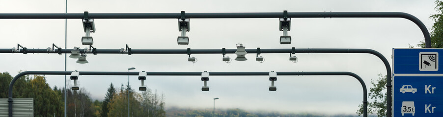 panorama of automatic road toll cameras in norway. taxes and transport concept.