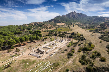 Fototapeta na wymiar Aerial view with drone; Sardes (Sardis) Ancient City which has gymnasium and synagogue ruins and columns in Manisa, Turkey.