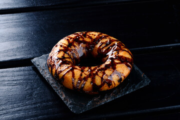donut with chocolate sauce close up