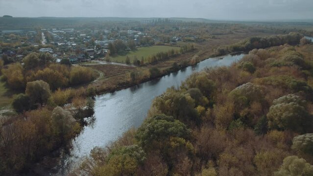 A village along the big river, a village in Russia, aerial photography of a Russian village