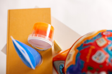 Colorful collection of various school supplies over white