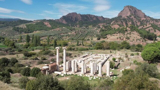 Aerial view with drone; Sardes (Sardis) Ancient City which has gymnasium and synagogue ruins and columns in Manisa, Turkey.