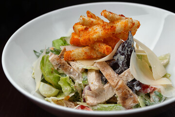 Caesar salad on a plate. Shallow depth of field