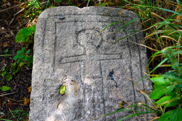 Antique carved drawing of a man on stone