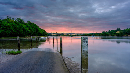 Sunrise on the River Avon tidal road near Aveton Gifford, South Hams, Devon, UK