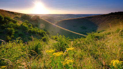 Mid-summer sunset over the Meon Valley from Butser Hill, South Downs National Park, UK