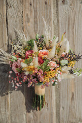 Marry at the North Sea. Summer wedding on the beach in Germany. Bridal bouquet with white and green