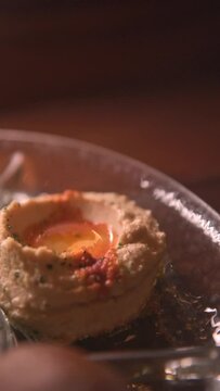 Vertical video of the plate of hummus. Arabic food vertical video. middle eastern food concept