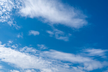 White clouds blue sky background.