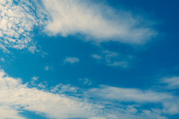 White clouds blue sky background.