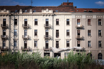 Facade of a abandoned hotel, in derelict, in Europe, seen from the outside, ready for renovation and urban renewal...