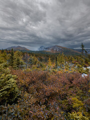 View of Baxter Peak from Chimney Pond Trail overlook in Maine with brilliant fall foliage 