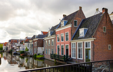 Fototapeta na wymiar Scenic view of canals,boats and ancient buildings of Dutch city of Leiden, province of South Holland
