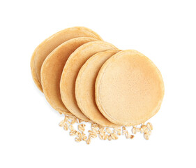 Tasty oatmeal pancakes and flakes on white background, top view