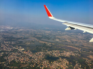 Aerial view of house and land through an airplane window