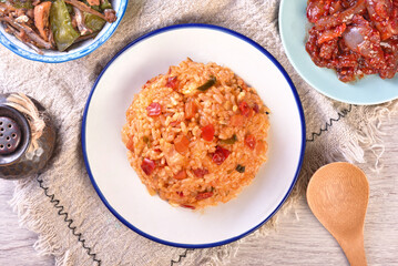 Kimchi fried rice with cheese on white plate