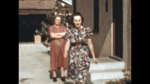 Three Generations Stroll 1940 - Grandmother and mother stroll in the driveway with the granddaughter in a Taylor Tot Stroller in Los Angeles, California in 1940.