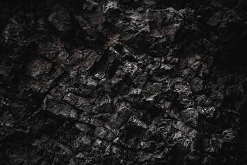 Black texture. Stone background. Dark marble. Rock texture. Rock surface with cracks. Rock pile. Paint spots wall. Grunge Rough structure. Abstract texture.