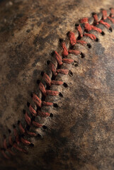 Fototapeta na wymiar Red Stitching on an anitique baseball