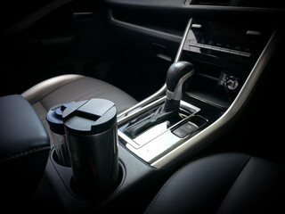 Two Bottles Holders Car in Front Seat Next to Transmission Console Concept