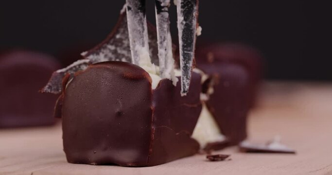 Take a fork of sweet curd cheese made from milk with milk chocolate, a sweet dessert made from dairy products and chocolate