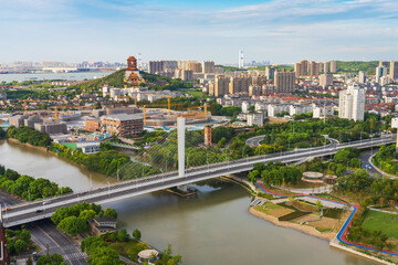 Obraz premium Overlooking the skyline and canal bridge of modern urban architecture in Jiangyin, China