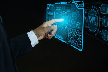 Businessman pointing his finger at technology icon