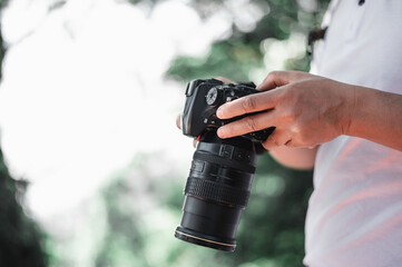Close up of man hand checking a picture on camera