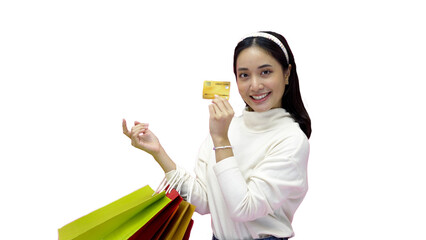 Happy Young woman smiling and hold shopping bags and credit card while doing some shopping on a...