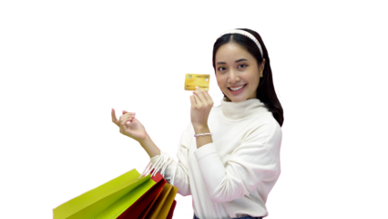 Happy Young woman smiling and hold shopping bags and credit card while doing some shopping on a pink studio background