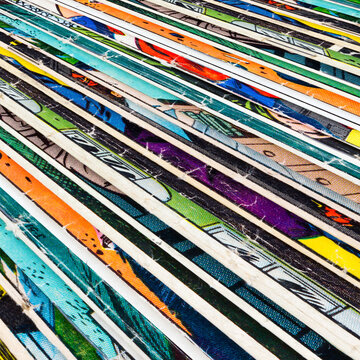Old comic books stacked in a pile creates colorful background texture with abstract shapes and colors