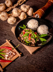 Papaya salad in white dish (Thai called Som tam) on fresh banana leaf, Choose focus and free space for message.