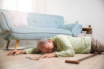 Sick senior man beside couch on rug in living room at home, Elderly mature grandfather having an...