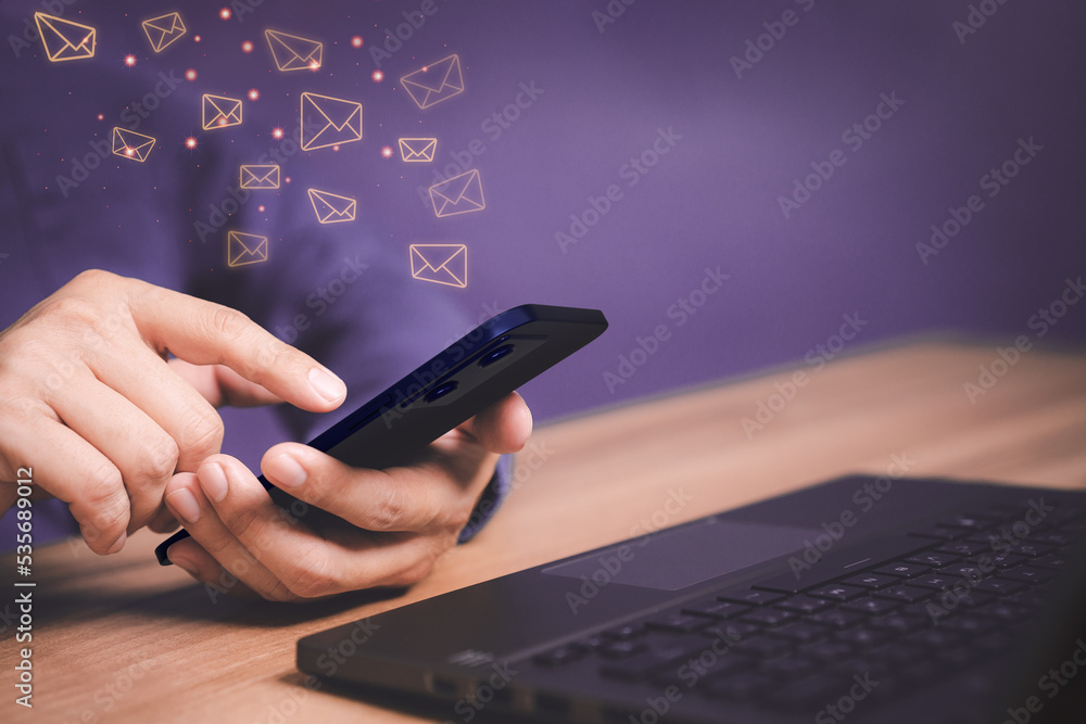 Aufkleber Email Marketing and Newsletters, Technology and lifestyle concepts. Man's hand using smartphone or mobile phone and sending online message with email icon.