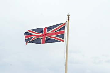 Flag / Ensign of Great Britain / England waving in the wind on the flagpole, UK United Kingdom