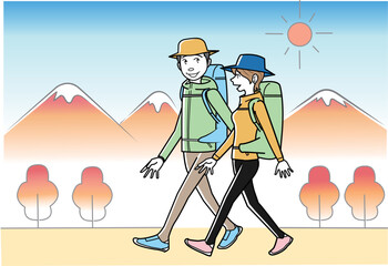 秋の登山を楽しむカップル