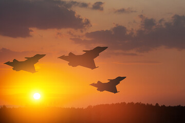 Air Force Day. Aircraft silhouettes on background of sunset or sunrise.