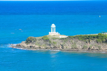 Idyllic Caribbean scene with gazebo and turquoise waters of the Caribbean Sea in the Dominican...