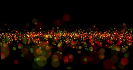 Flying luminous particles of different sizes and colors on a black background. Particles from bokeh. The surface is made of multi-colored particles.